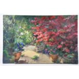 † JUNE BEVAN; two oils on canvas, both of garden scenes, both signed lower right, 51 x 66cm, both