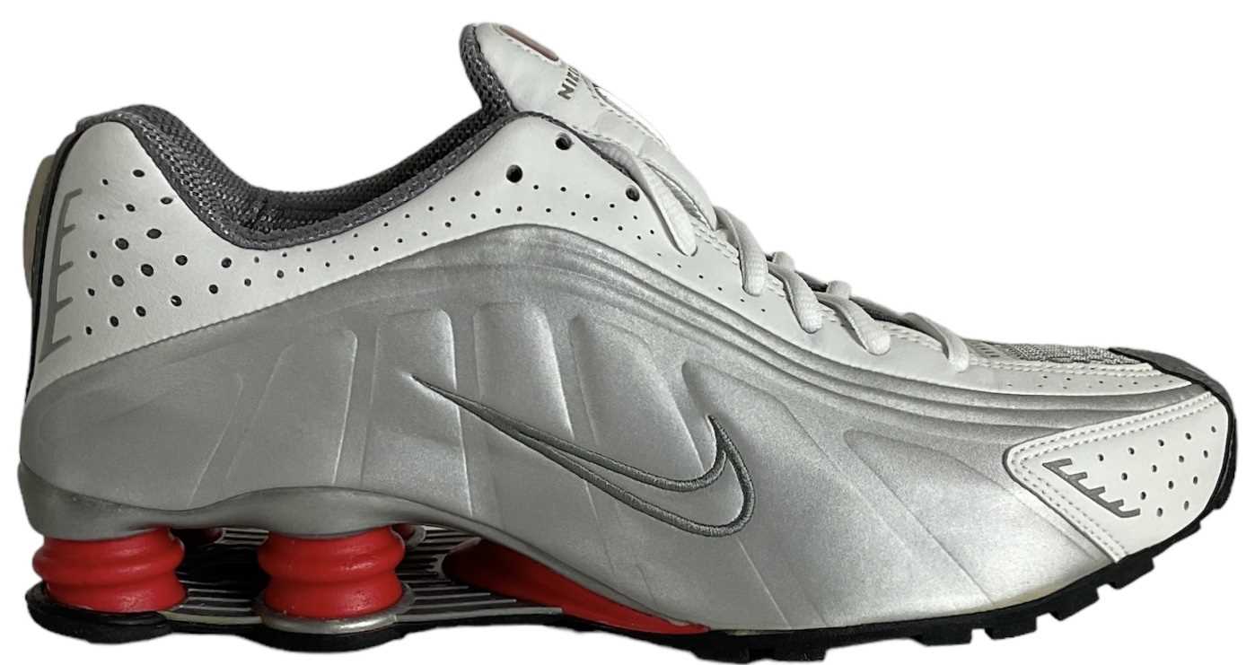 NIKE; a pair of Shox R4 metallic silver/cool grey and red trainers, size UK 7 (boxed). Condition