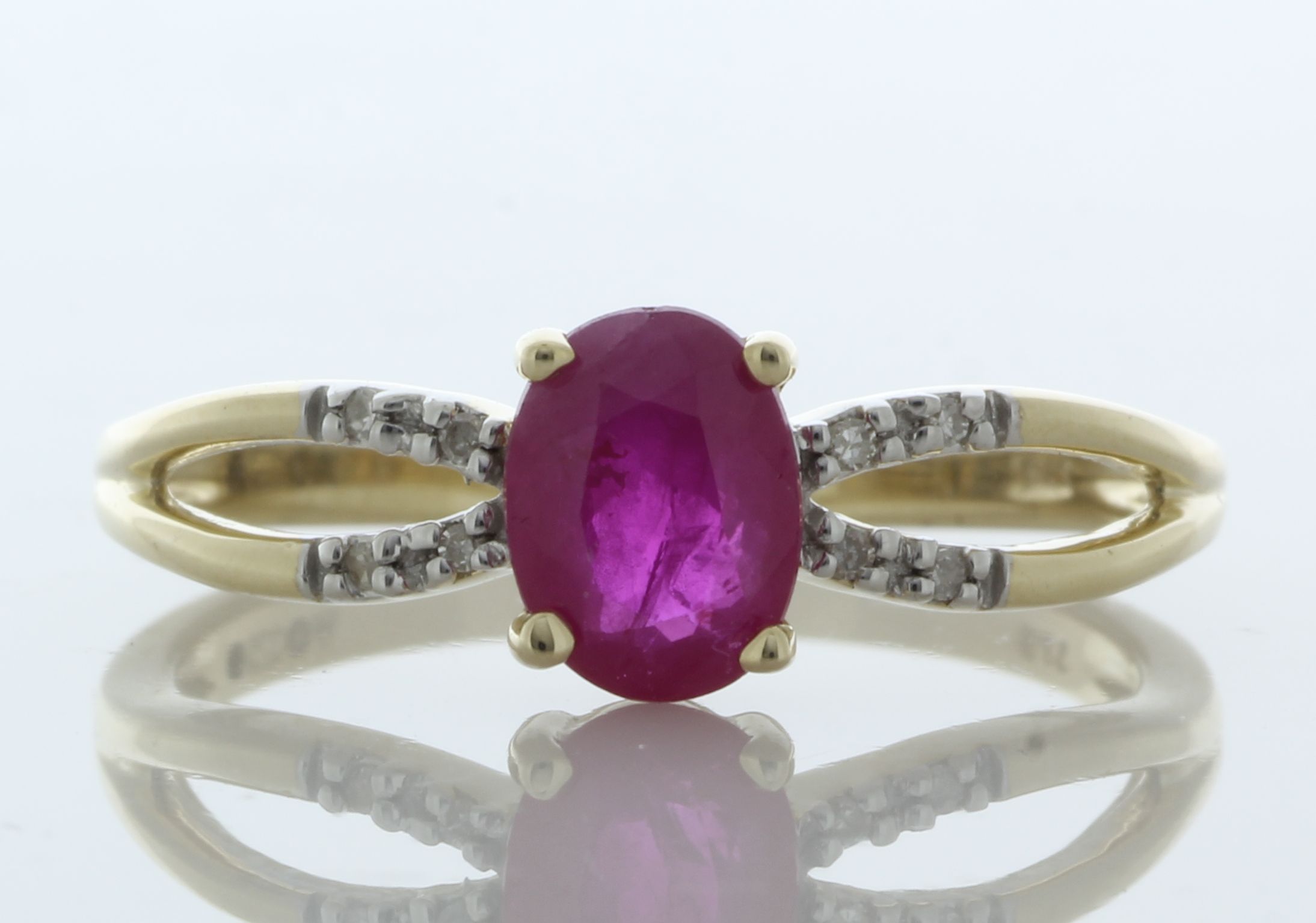 9ct Yellow Gold Diamond And Ruby Ring (R0.81) 0.03 Carats - Valued By IDI £2,505.00 - An oval 8mm