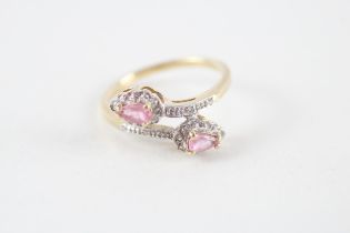 9ct gold pink sapphire & diamond cross over ring (2.1g) Size O