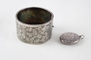 A decorative Victorian silver bangle and locket (39g)