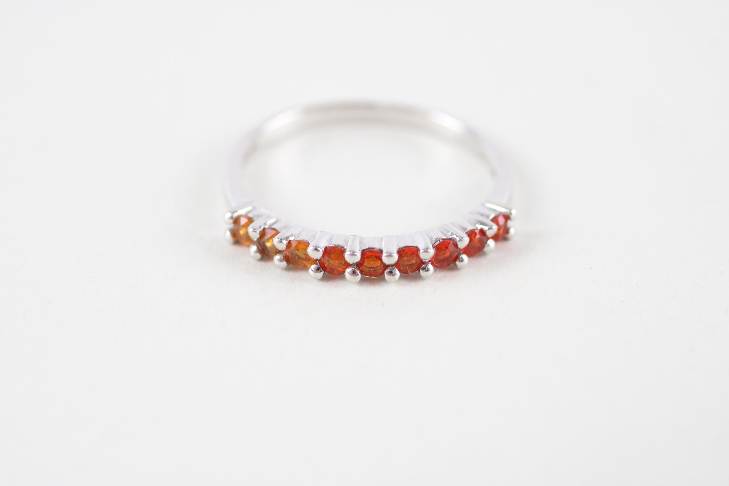 9ct white gold orange gemstone half eternity ring (1.2g) Size M