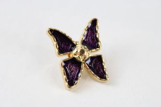 A vintage gold tone butterfly brooch by Yves Saint Laurent (10g)