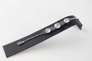 An early to mid 20th century silver moonstone and sapphire bracelet (12g)