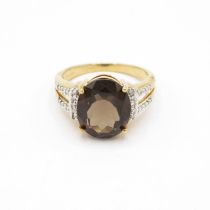 HM 9ct gold dress ring with smoky centre stone and white stones on shoulders ( 4g) Size N
