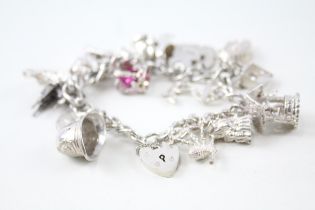 Silver charm bracelet including souvenir charms (56g)