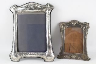 2x silver photo frames. Large frame measures 30cm x 24 cm, small frame measures 21cm x 17cm //