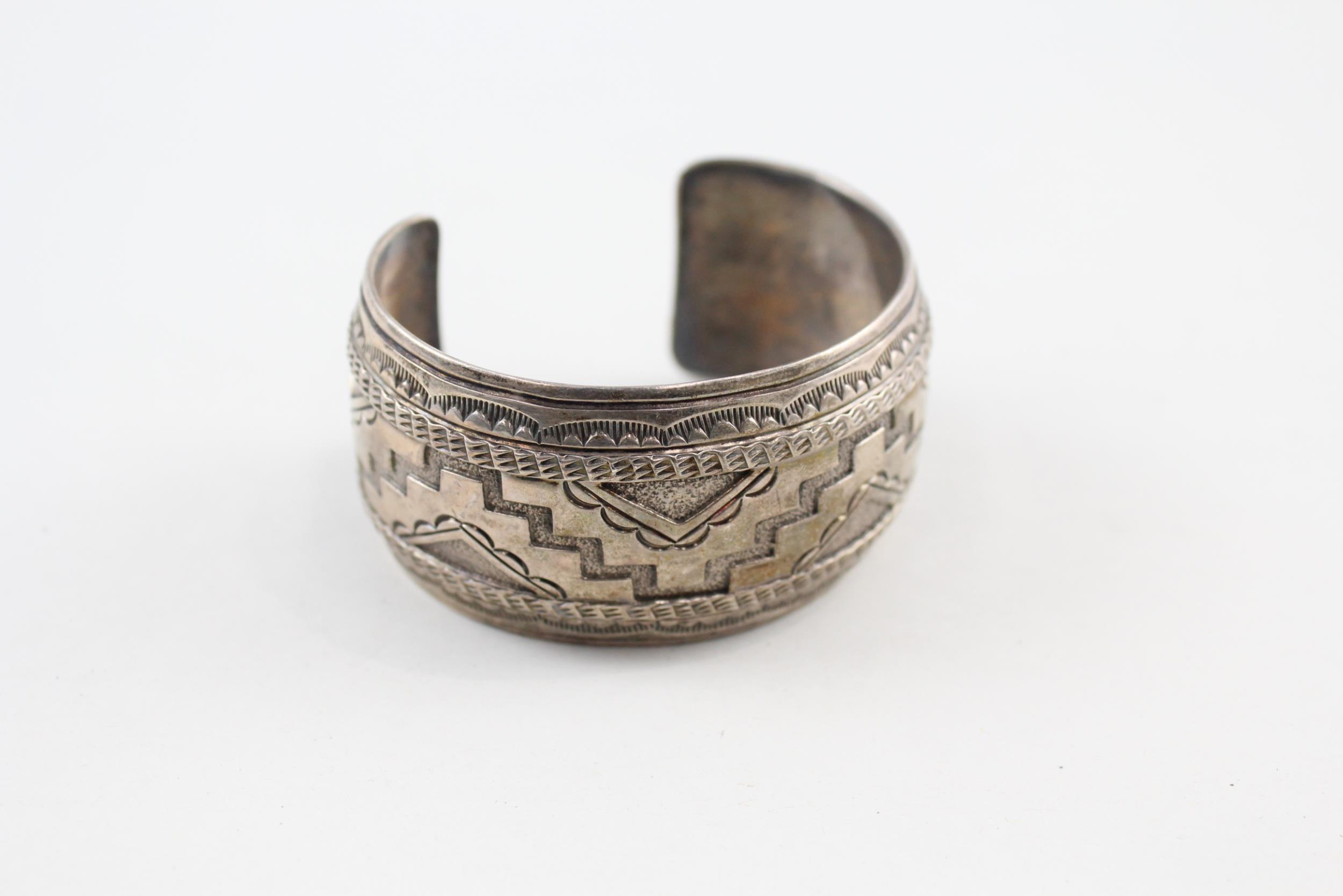 Silver Navajo bangle signed R. Wylie (55g)