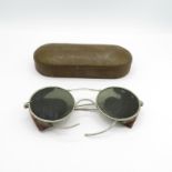A military tinted spectacles in tin