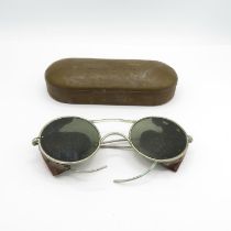 A military tinted spectacles in tin