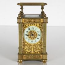 A Filigree brass midsized carriage clock. Clock is running. 130mm x 80mm //