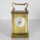 A small sized carriage clock 110mm x 70mm. Clock requires full service //