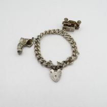 A silver hallmarked charm bracelet 46.5g