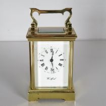 A Woodford midsized chiming carriage clock with 13 unadjusted jewel. 120mm x 80mm. Fully running //