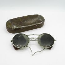 A set of military issued spectacles in tin