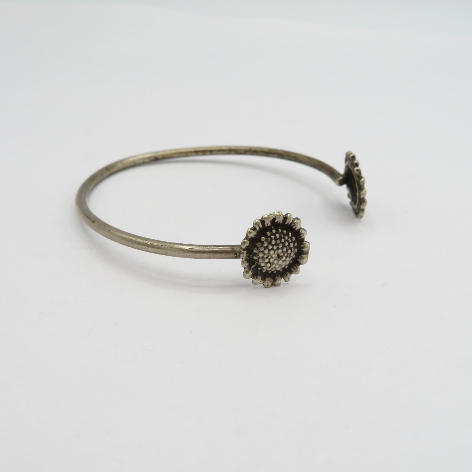 2 silver bangles one daisy ending and one dolphin ending 20.5g - Image 6 of 7