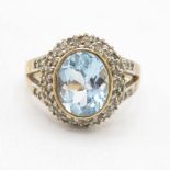 9ct gold blue topaz single stone ring with diamond frame & split shank (5g) Size P