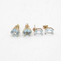 2x 9ct gold blue topaz stud earrings with scroll backs (2.6g)