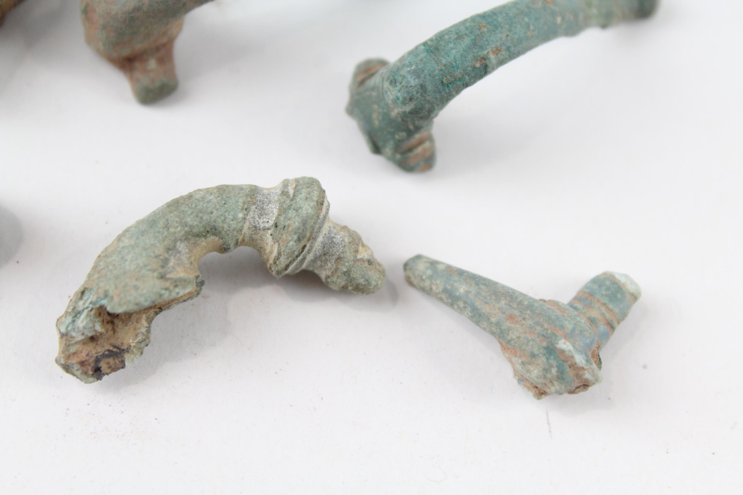 A collection of partial Roman trumpet brooches archaeological metal detectorist finds (g) - Image 6 of 6