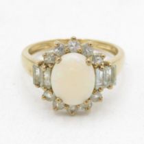 9ct gold opal & vari-cut aquamarine dress ring in a claw setting (2.9g) Size P