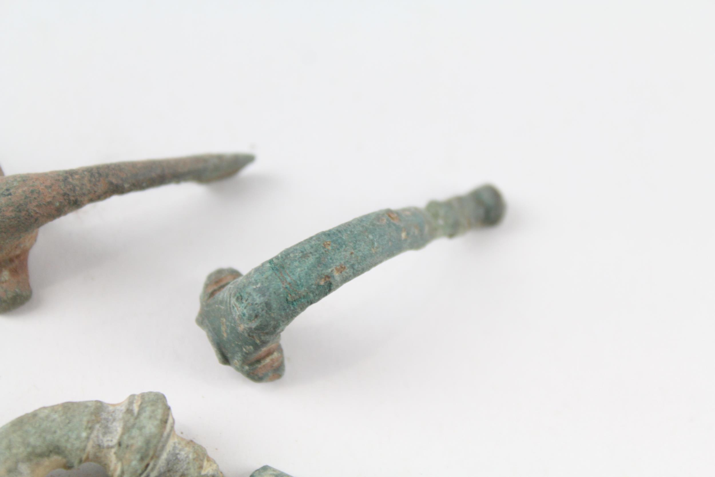 A collection of partial Roman trumpet brooches archaeological metal detectorist finds (g) - Image 5 of 6