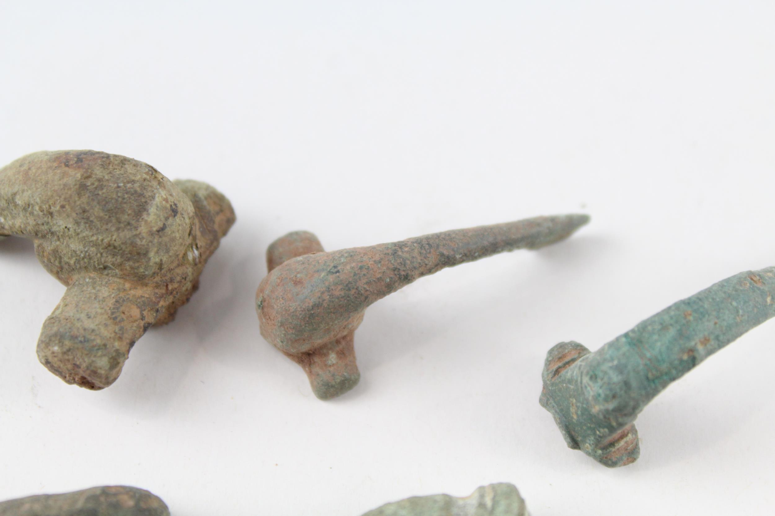 A collection of partial Roman trumpet brooches archaeological metal detectorist finds (g) - Image 4 of 6