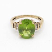 9ct gold peridot single stone ring with calibre cut diamond set shank (3.6g) Size Q 1/2