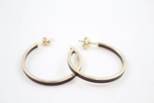A pair of gold tone enamel hoop earrings by designer Chloe (g)