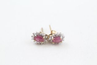 9ct gold oval cut ruby & diamond cluster stud earrings, claw set with scroll backs (1g)