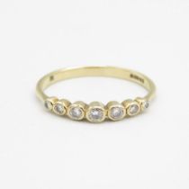 9ct gold graduated diamond half eternity ring in a bezel setting (1.1g)