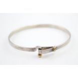 A silver bangle by Tiffany and Co with 18ct gold detailing (12g)