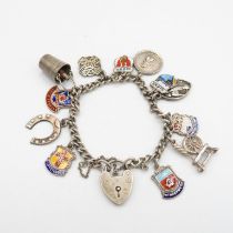 Fine silver charm bracelet with assorted charms including place names 29g