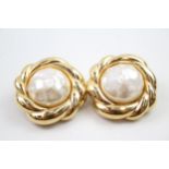 A pair of gold tone clip on earrings by designer Nina Ricci (g)