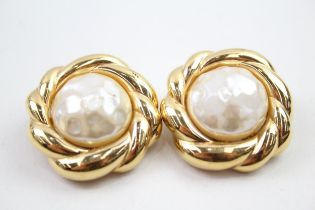 A pair of gold tone clip on earrings by designer Nina Ricci (g)