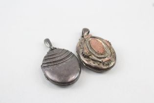Two silver antique locket pendants including gold accents (29g)