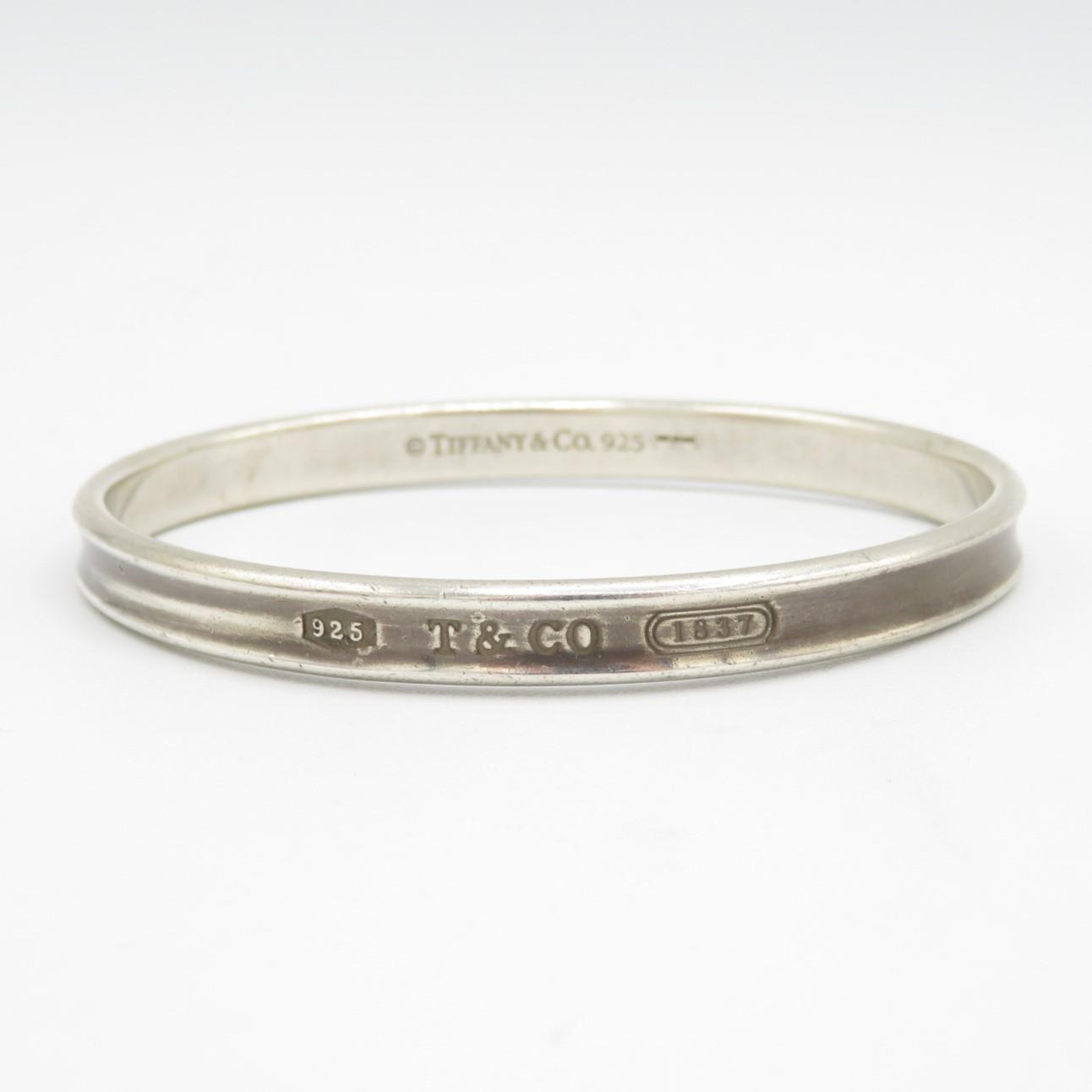 Silver bangle by designer Tiffany & Co (32g) - Image 6 of 12