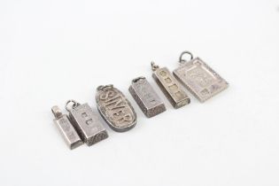 Six silver ingot pendants including Millennium hallmark (46g)