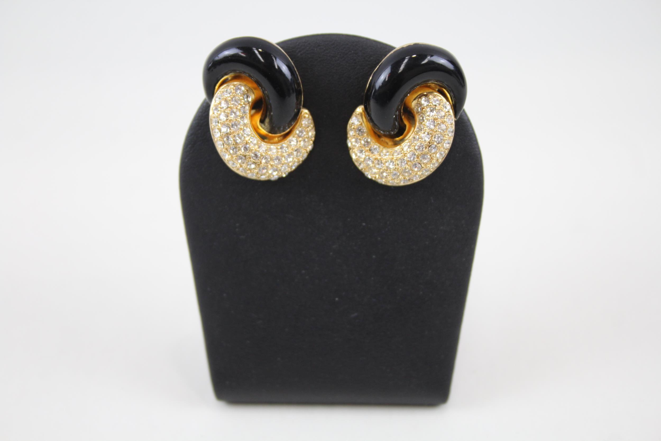 Pair of gold tone enamel and rhinestone clip on earrings by designer Christian Dior (23g)