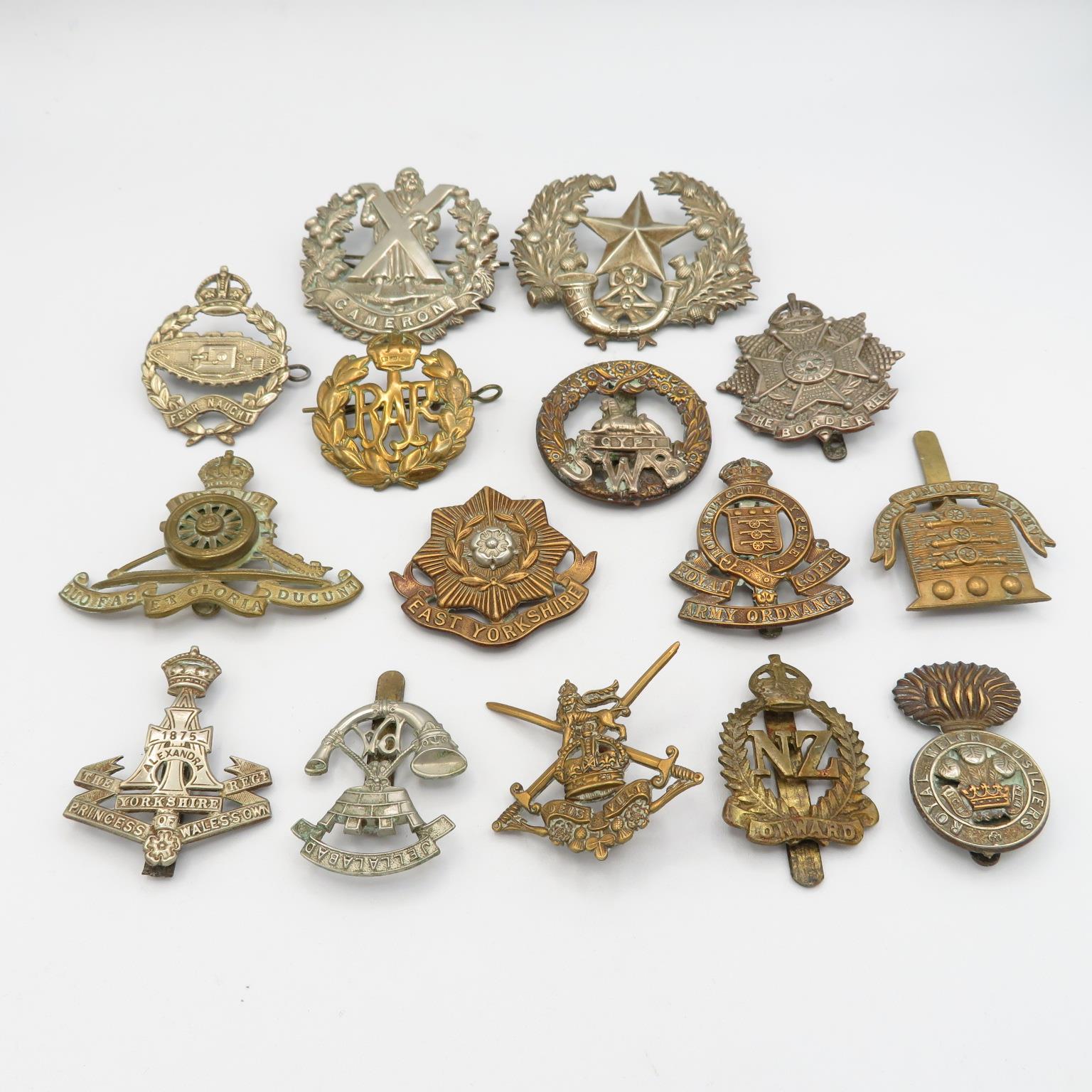 15x military cap badges including Tank Reg Border East etc. -