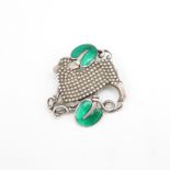 Georg Jensen silver lamb brooch with green enamel details design number 284