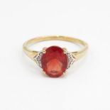 9ct gold red gemstone single stone ring with diamond sides Size R 1/2 2.1 g