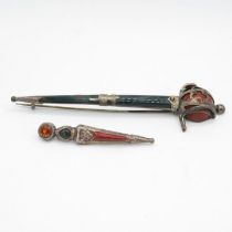 Two silver Scottish sword brooches set with gemstones (26g)