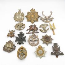 15x military cap badges including Royal Marines Helmet plate and Army Air Corps etc. -