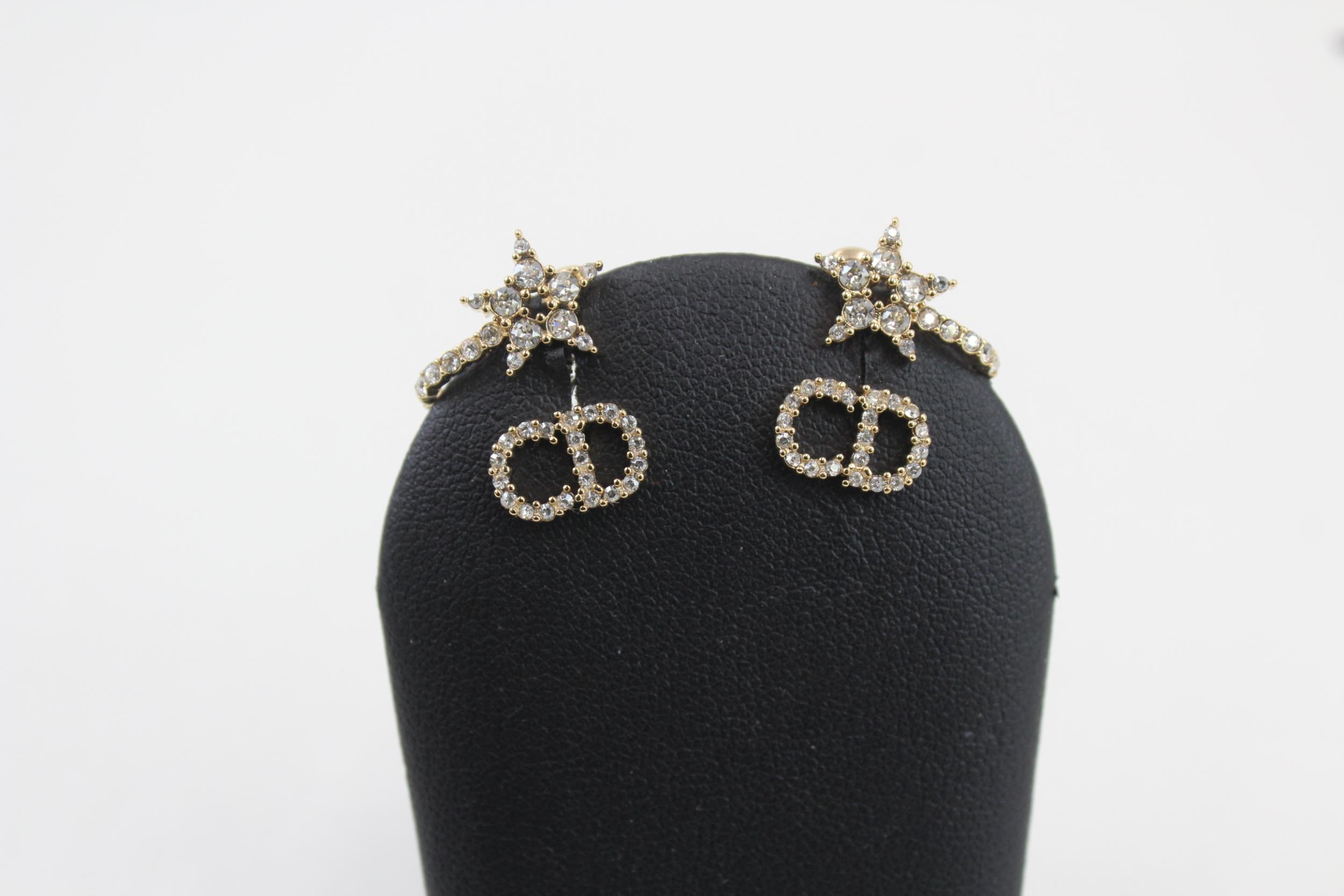 Pair of gold tone rhinestone earrings by designer Christian Dior with pouch (3g) - Image 2 of 7