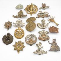 18x Military cap badges including Royal Scots Fusiliers and Lancers etc. -