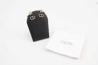 Pair of gold tone rhinestone earrings by designer Christian Dior with pouch (3g)