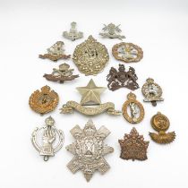 15x Military cap badges including Canadian and South Lancs etc. -