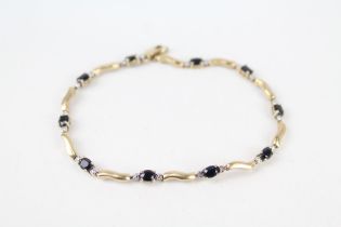 9ct gold sapphire set wave link bracelet 4.6 g