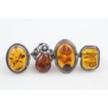 Four silver amber cocktail rings (26g) Size M, N, P, Q