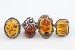 Four silver amber cocktail rings (26g) Size M, N, P, Q